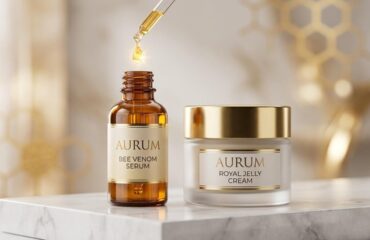 A luxury glass dropper bottle and moisturizer jar displayed on a marble surface, illustrating a premium bee venom skincare routine for anti-aging.